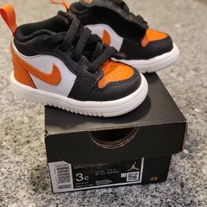 Nike Kids' Black, White, and Orange Sneakers